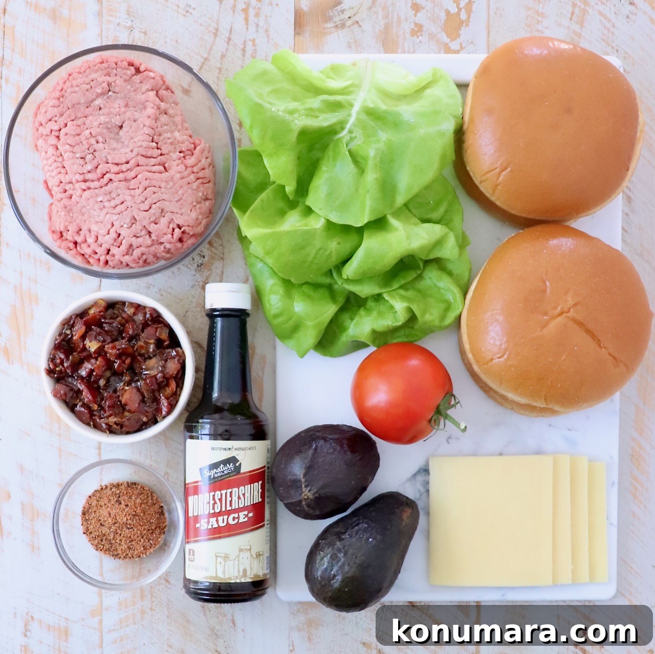 ingredients for California burgers on white wood board