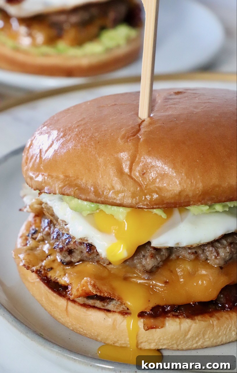 cheeseburger on plate topped with a fried egg