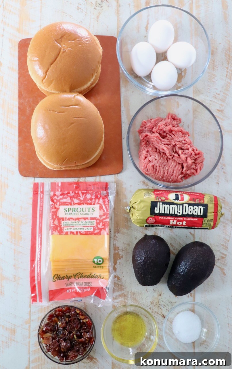 ingredients for breakfast burger on white wood board