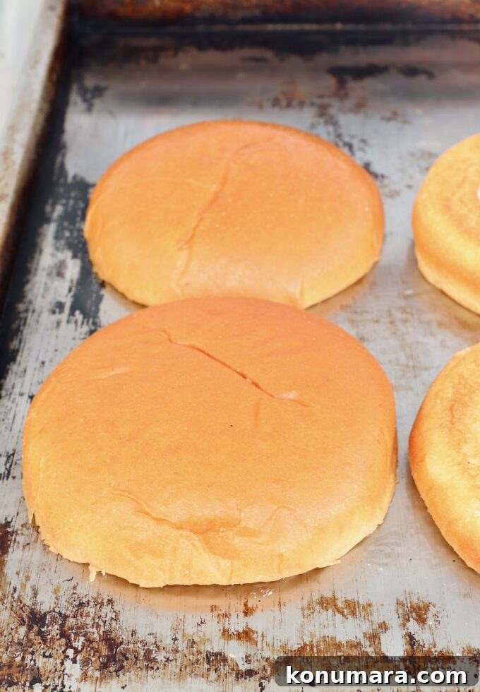 hamburger buns toasting on flat top