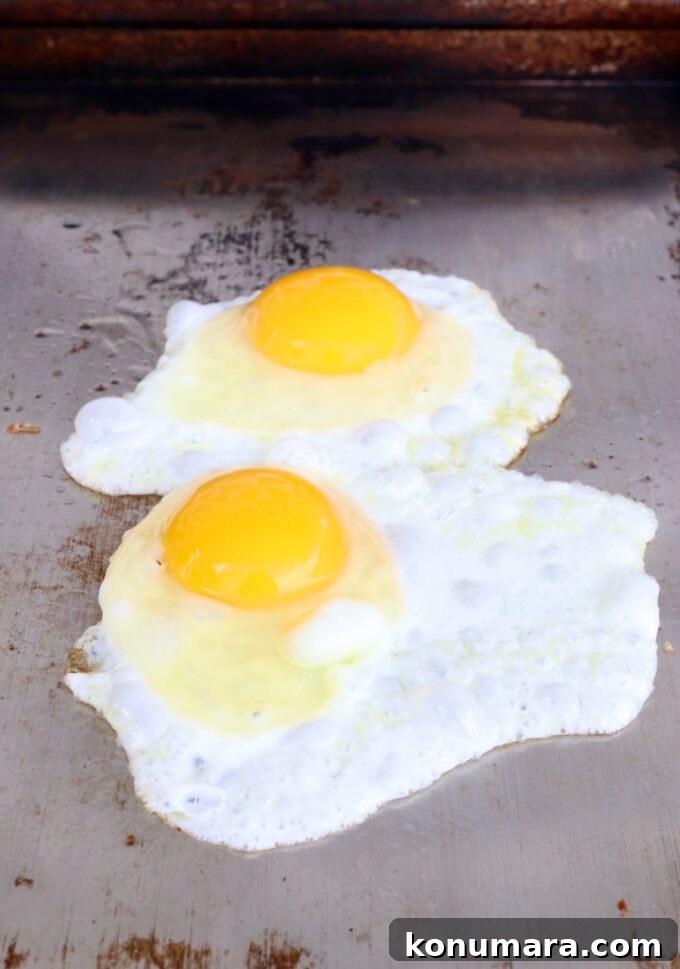 eggs frying on flat top