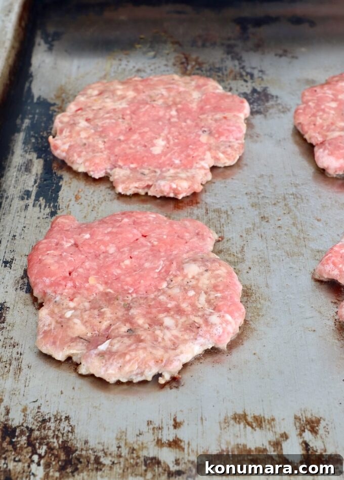 smashed burger patties on flat top 