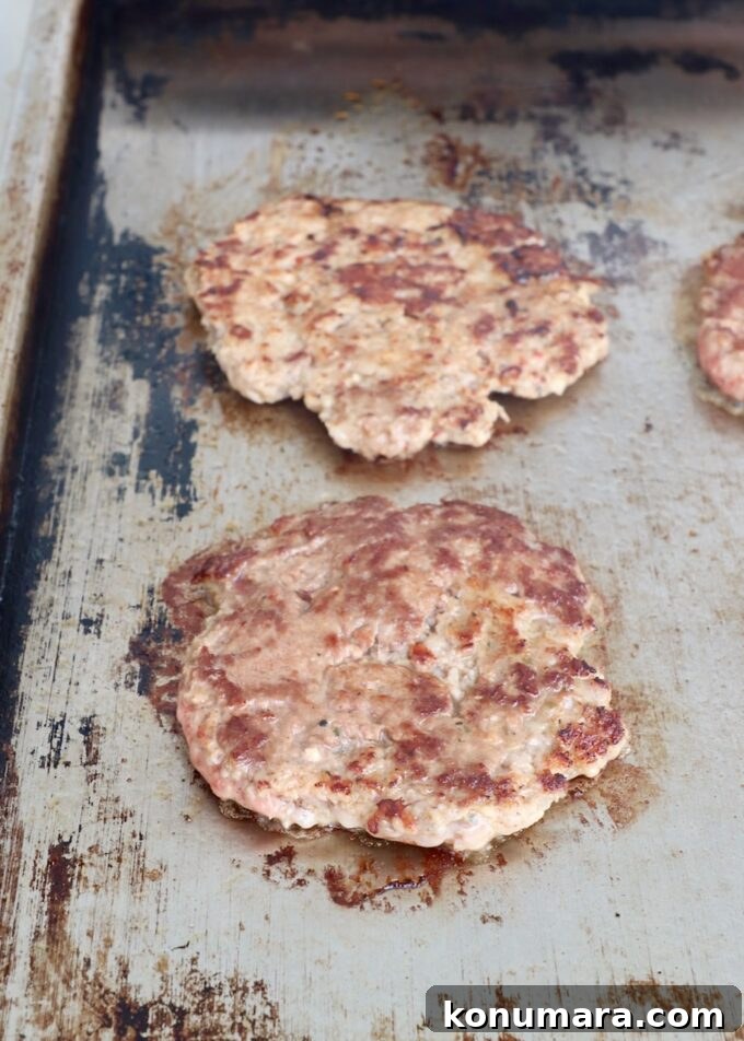 cooked smashed burgers on flat top