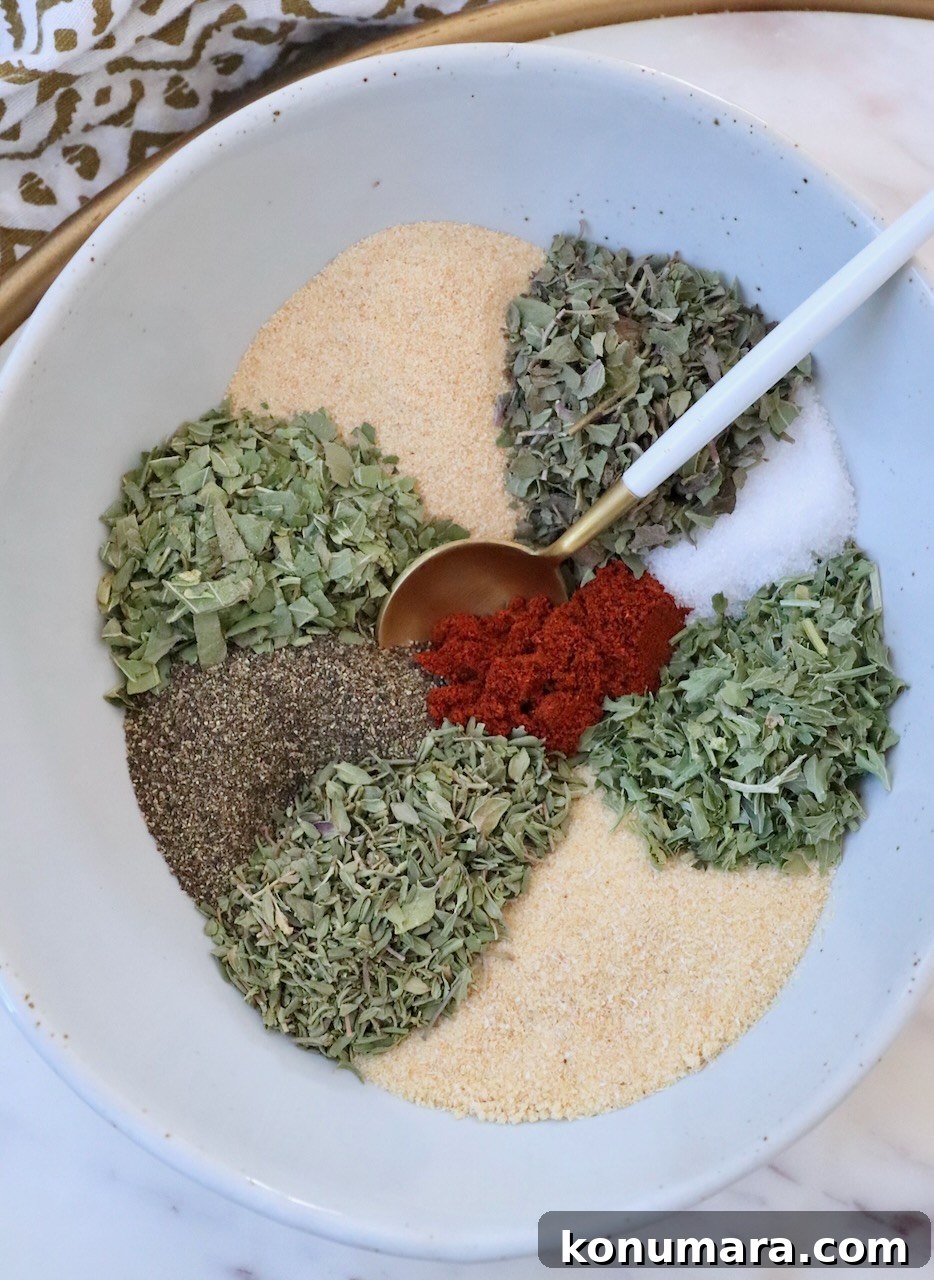 Vegetable Seasoning: Herb and Spice Blend for Roasting 2 Dried herbs and spices separated in a bowl with a spoon
