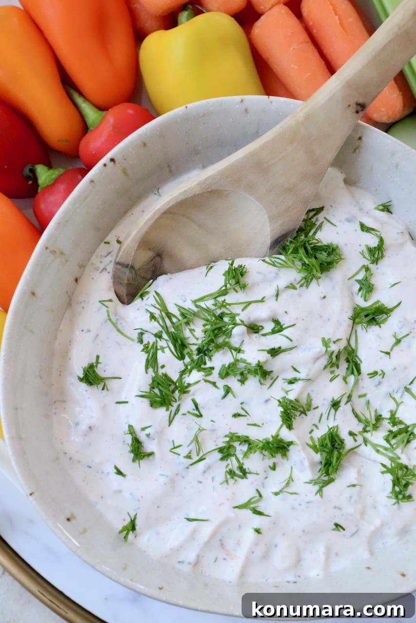 creamy dip in bowl topped with fresh chopped dill