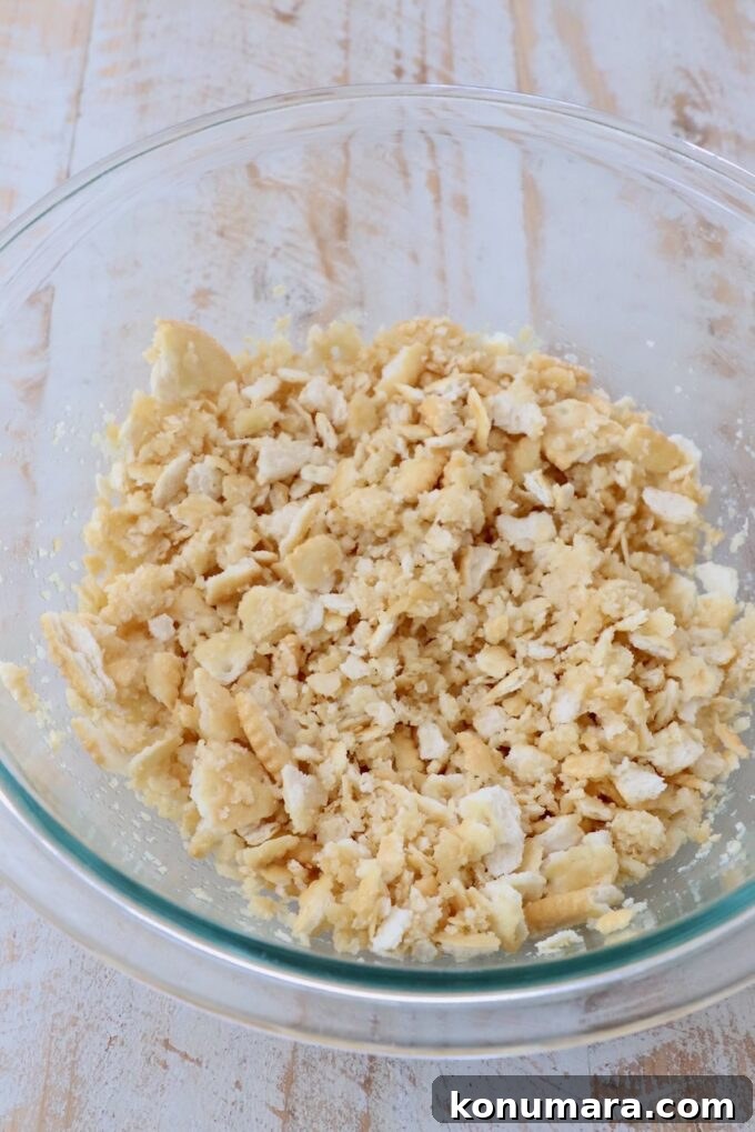 crumbled crackers combined with butter in a glass bowl