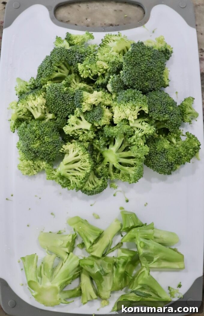 Crunchy Broccoli Slaw Recipe with Creamy Dressing 4 broccoli florets and stems on cutting board