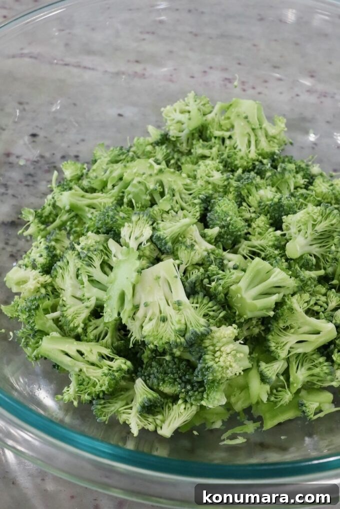 Crunchy Broccoli Slaw Recipe with Creamy Dressing 7 chopped up broccoli in bowl