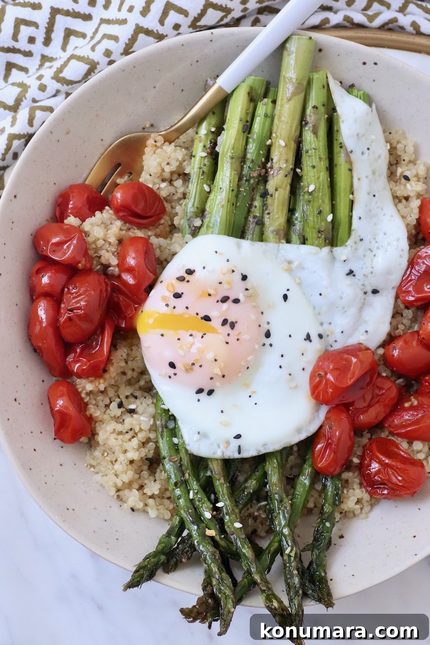 How to Cook Asparagus: Roasted, Grilled, Steamed and Sauteed 13 cooked asparagus in bowl with roasted tomatoes, quinoa and a fried egg