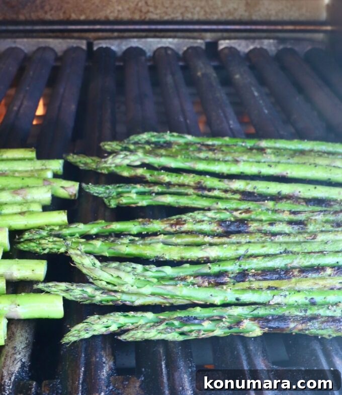 How to Cook Asparagus: Roasted, Grilled, Steamed and Sauteed 5 fresh asparagus spears on a grill