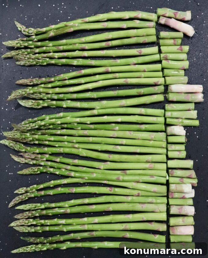 How to Cook Asparagus: Roasted, Grilled, Steamed and Sauteed 6 asparagus on cutting board with ends removed