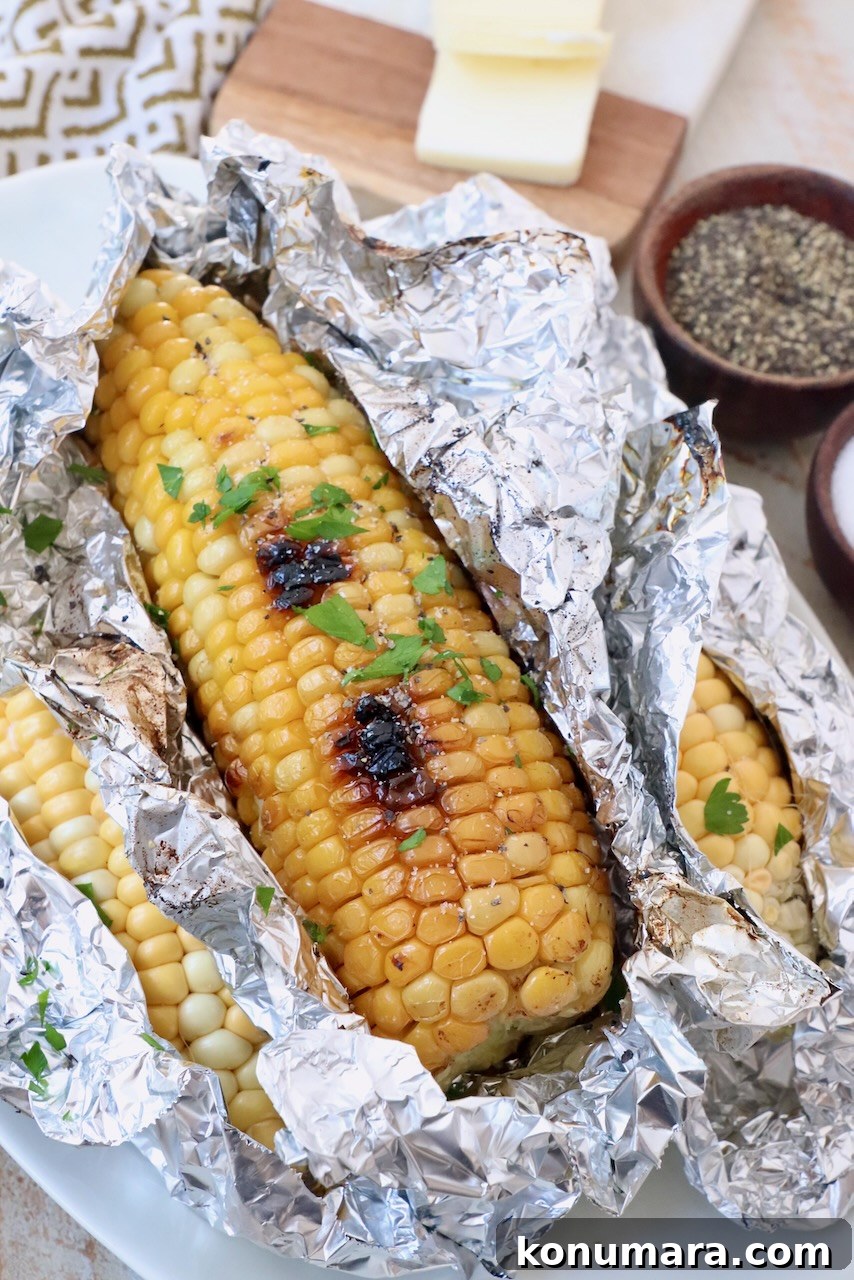 Grilled corn on the cob in foil