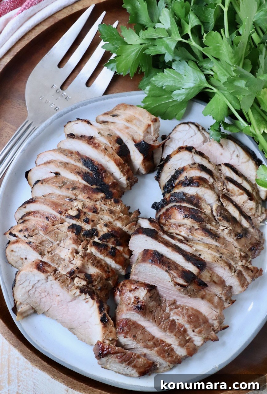 Savory Pork Tenderloin Marinade for Tender, Juicy Meat 9 sliced grilled pork tenderloin on plate