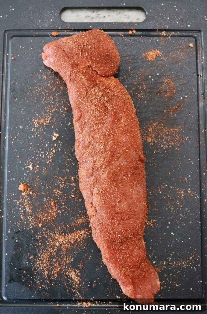 Grilled Pork Tenderloin Recipe with Garlic-Herb Rub 4 seasoned pork tenderloin on cutting board