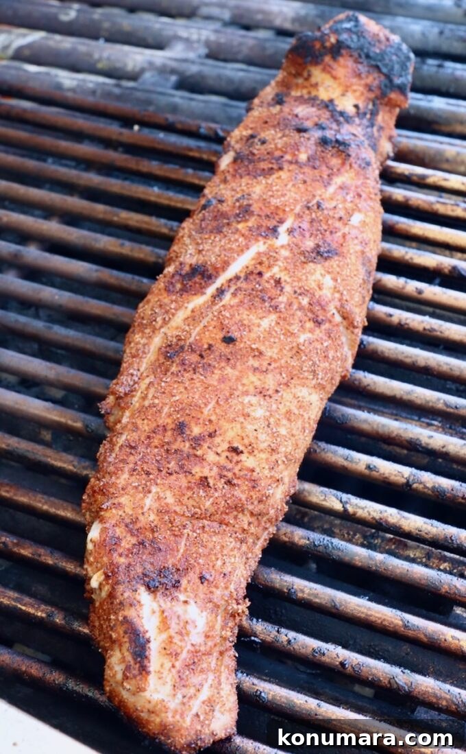 Grilled Pork Tenderloin Recipe with Garlic-Herb Rub 5 seasoned pork tenderloin on grill