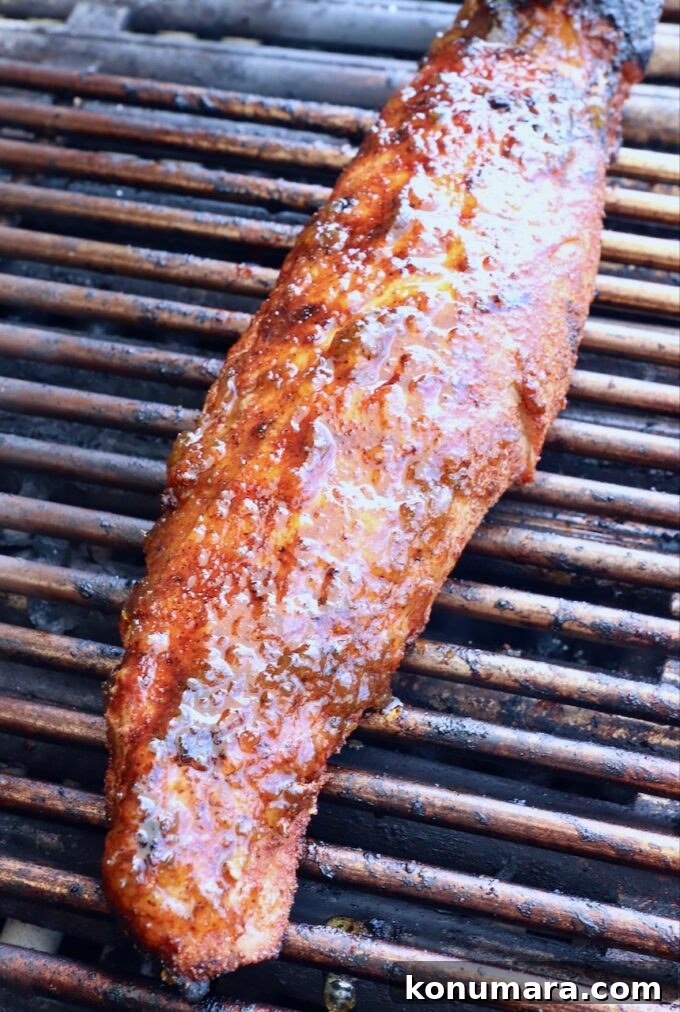 Grilled Pork Tenderloin Recipe with Garlic-Herb Rub 6 glazed pork tenderloin on grill