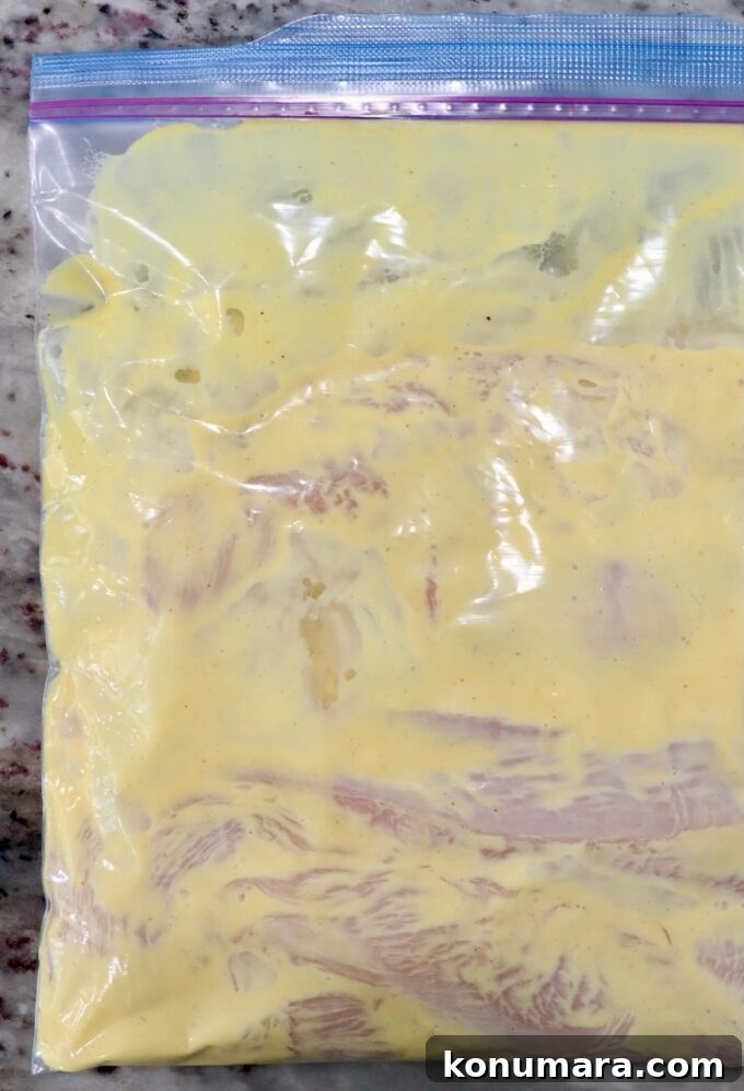 chicken breasts with honey mustard dressing in zipper bag