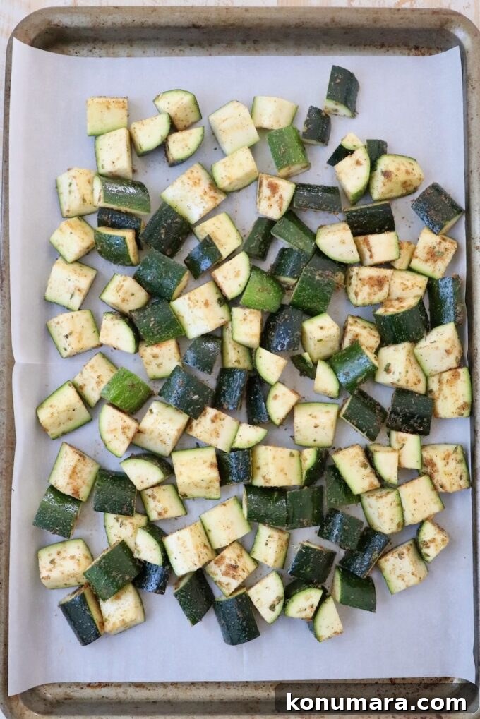 How to Cook Zucchini: Roast, Saute, Grill, Stir-Fry 7 seasoned diced zucchini on parchment lined baking sheet