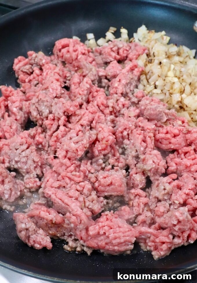 ground beef, diced onions and garlic in a large skillet