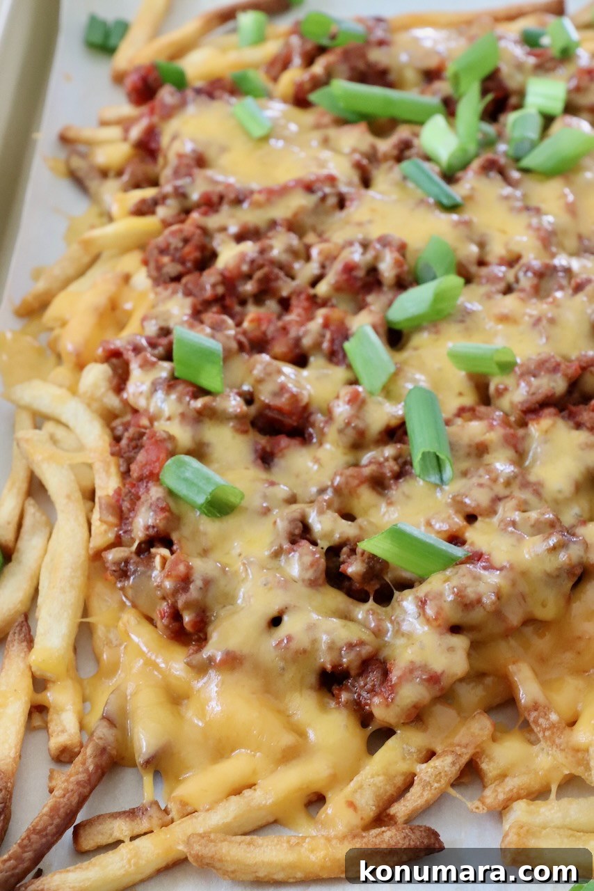 chili cheese fries on baking sheet