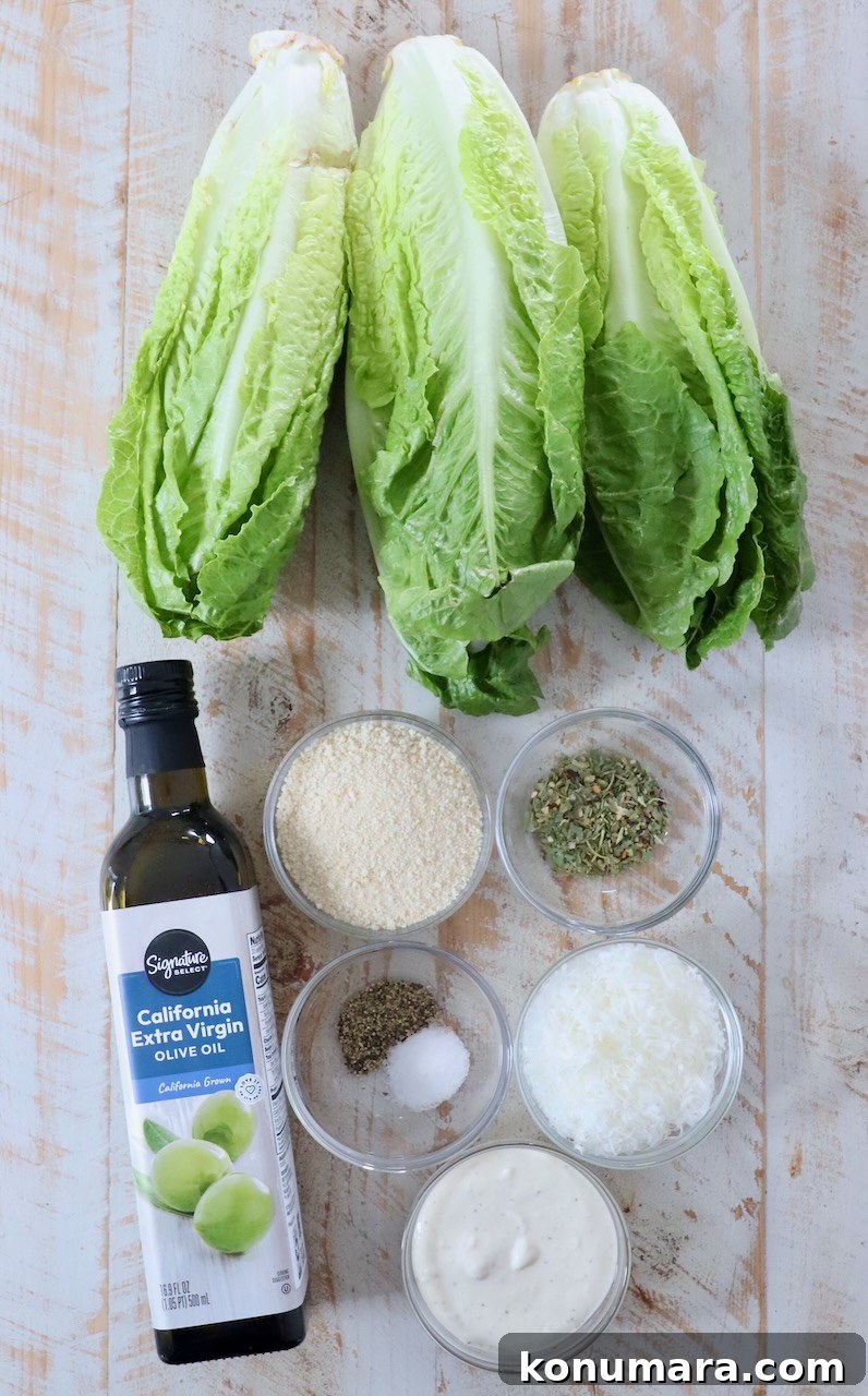 Grilled Caesar Salad with Charred Romaine and Garlic Croutons 5 ingredients for grilled caesar salad on white wood board