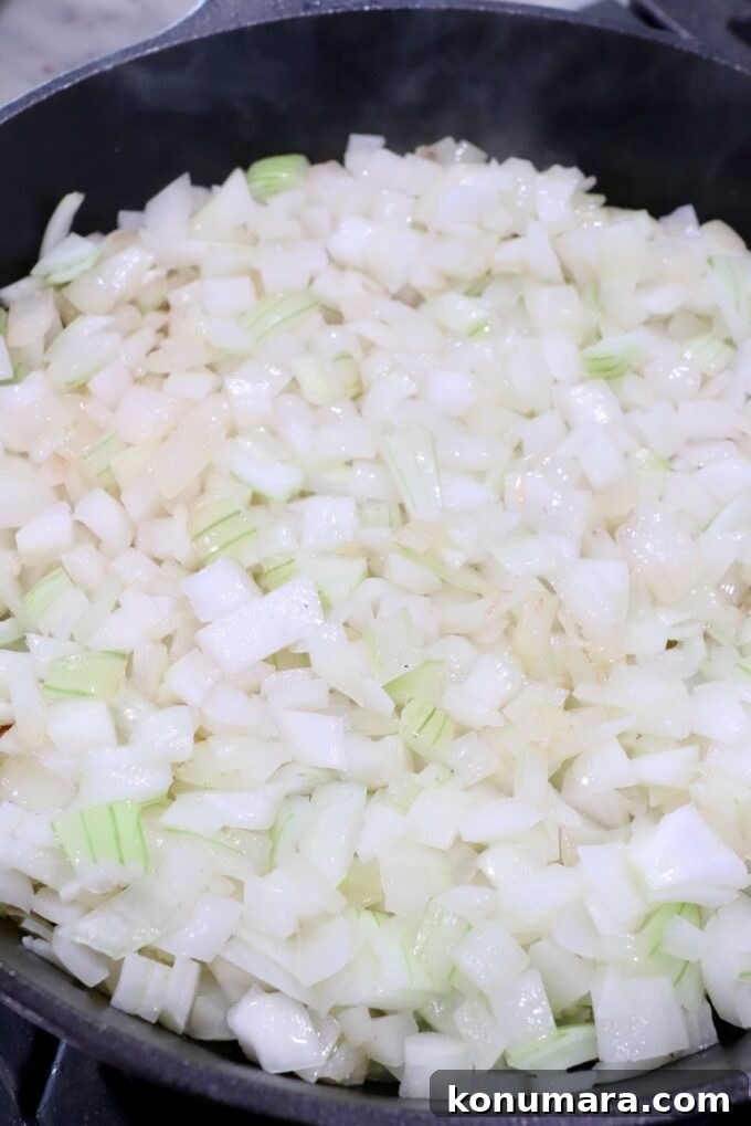 diced onions in cast iron skillet