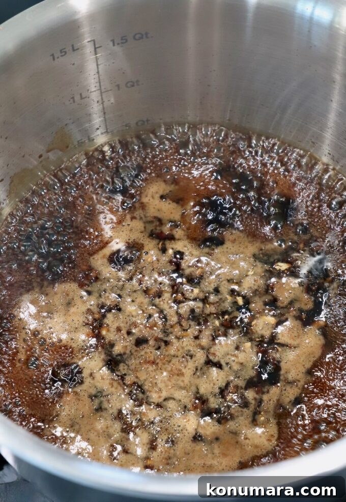 teriyaki sauce bubbling in pot on the stove