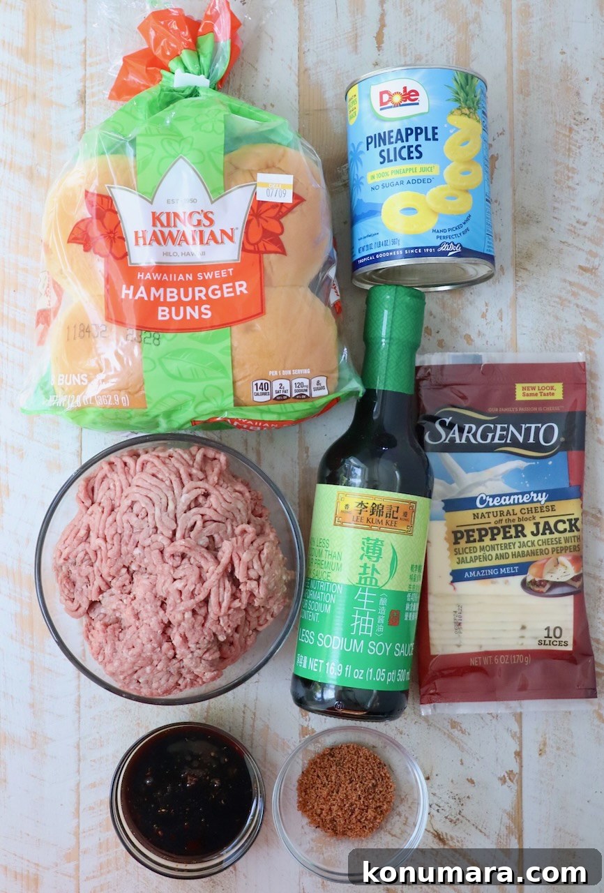 Hawaiian Burger with Grilled Pineapple and Teriyaki Sauce 3 ingredients for Hawaiian burgers on white wood board