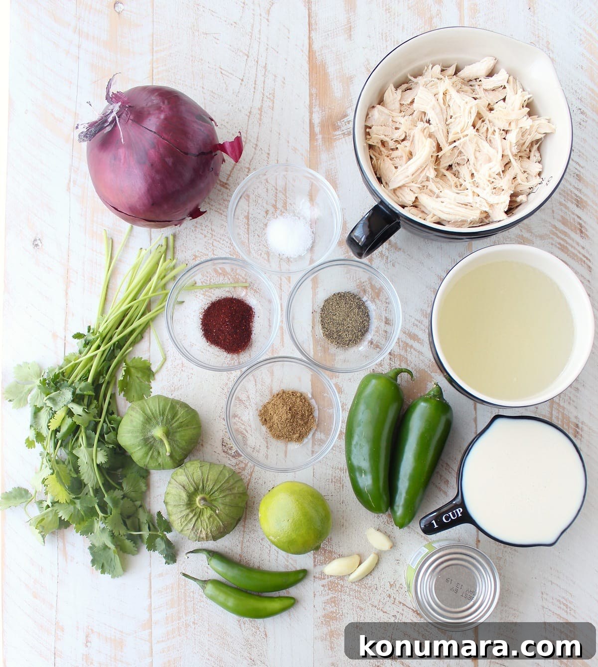 Creamy Green Chili Chicken Enchilada Soup Recipe 3 Ingredients for Green Chili Chicken Enchilada Soup on a wooden surface.
