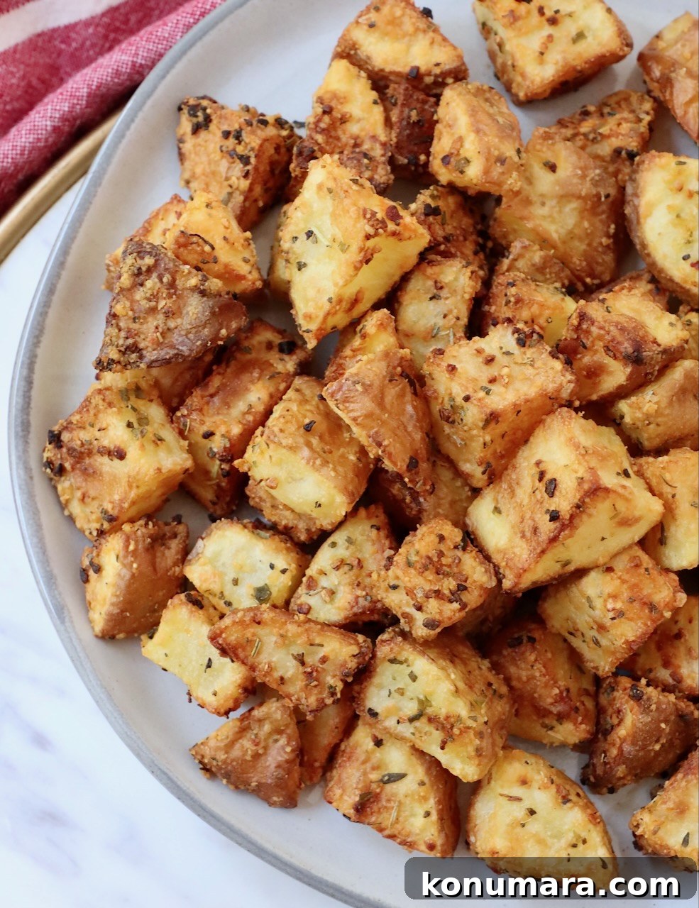 crisp roasted cubed potatoes on a plate