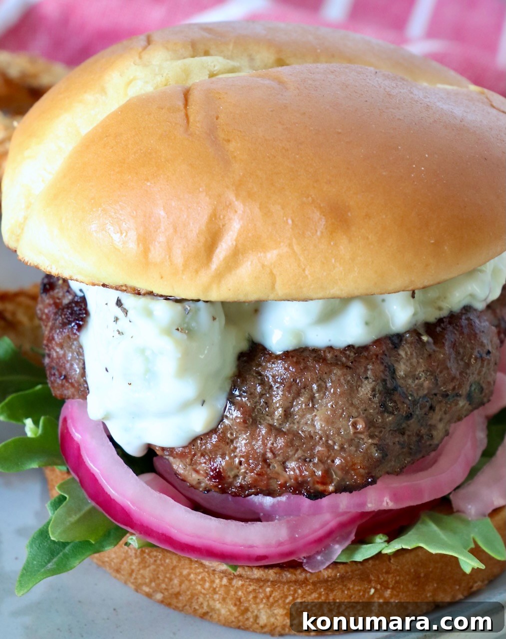 Classic Blue Cheese Burger Recipe 11 burger topped with blue cheese sauce on plate