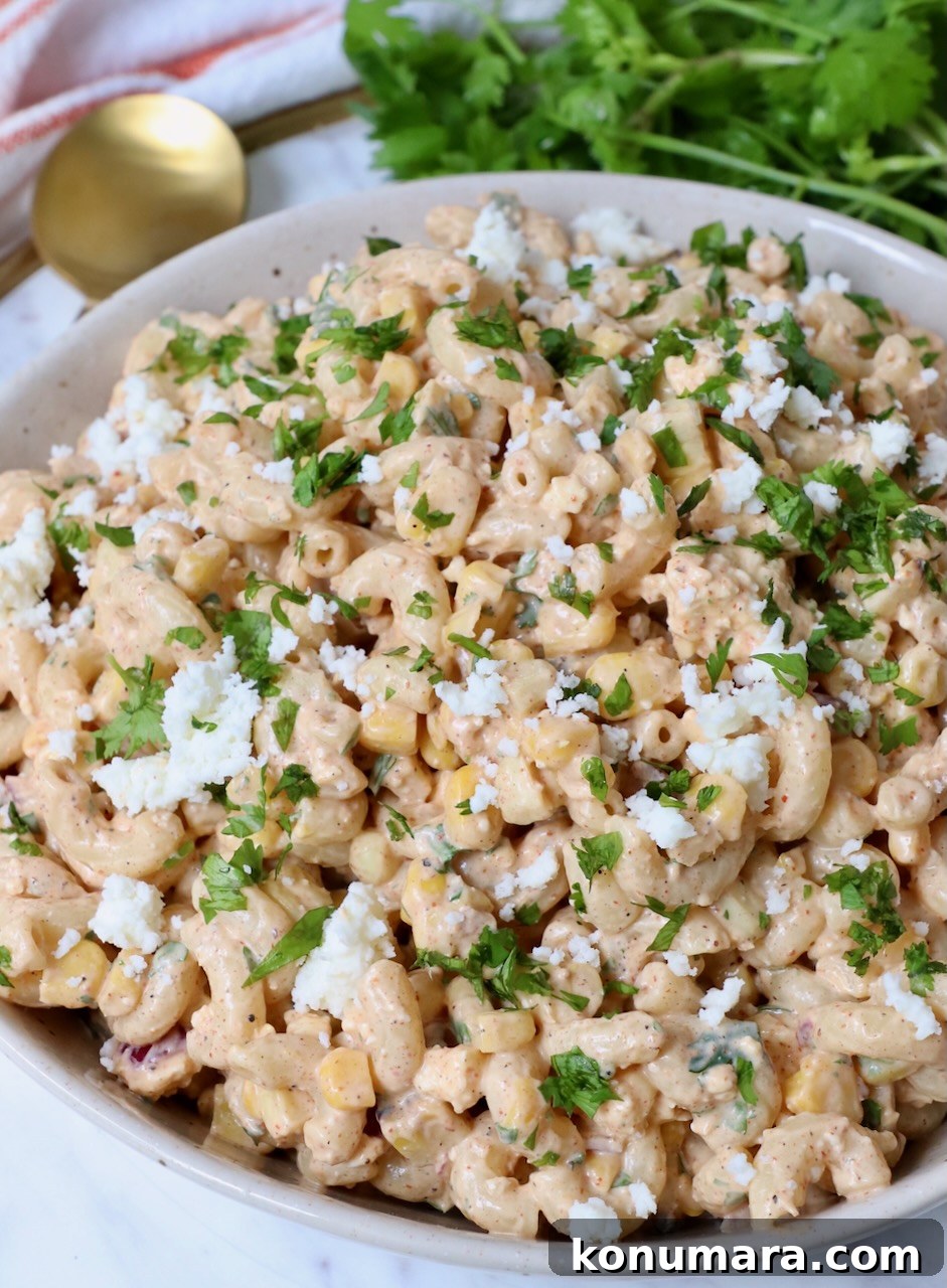 Elote Pasta Salad with Roasted Corn and Cotija 2 Mexican street corn pasta salad in bowl