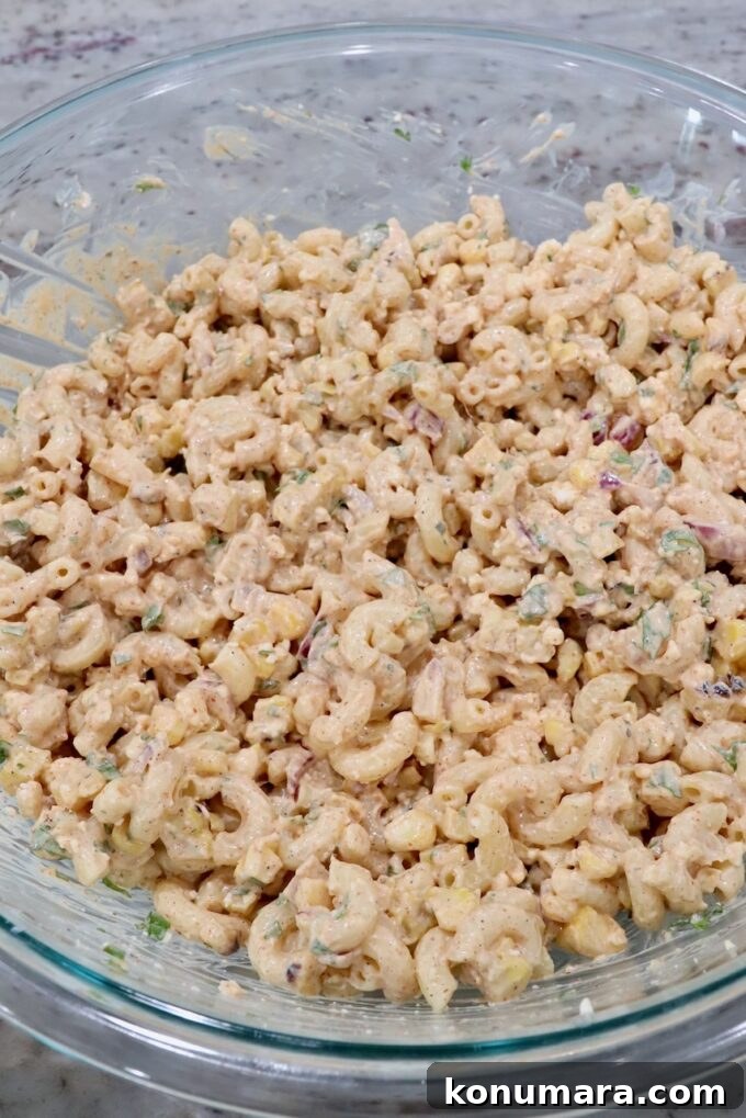 Elote Pasta Salad with Roasted Corn and Cotija 7 Mexican street corn pasta salad in large glass bowl