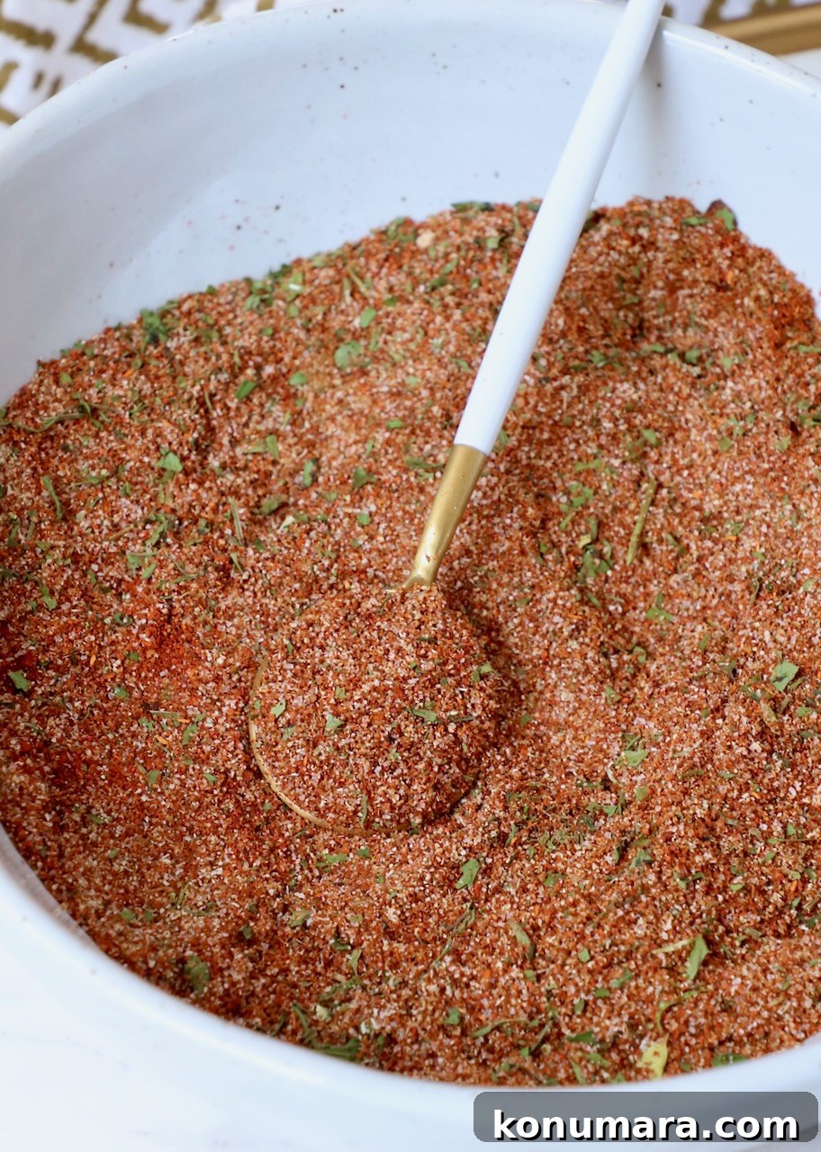 Authentic Carne Asada Seasoning for Tacos and Grilling 2 carne asada seasoning in bowl with spoon