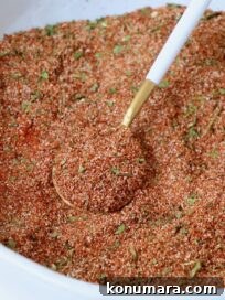 carne asada seasoning in bowl with spoon