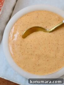 taco bell quesadilla sauce in small bowl with spoon