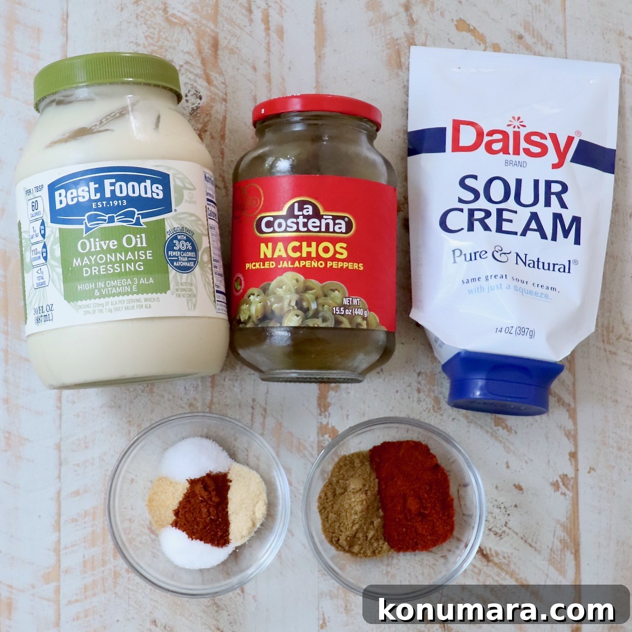 ingredients for copycat Taco Bell quesadilla sauce laid out on white wood board