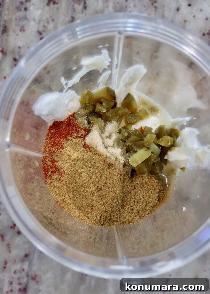 ingredients for creamy jalapeno sauce in blender cup