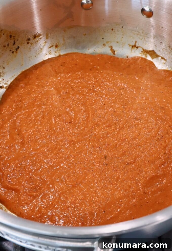 Smoky Chipotle Chicken Tinga Recipe 6 tinga sauce in pan on the stove