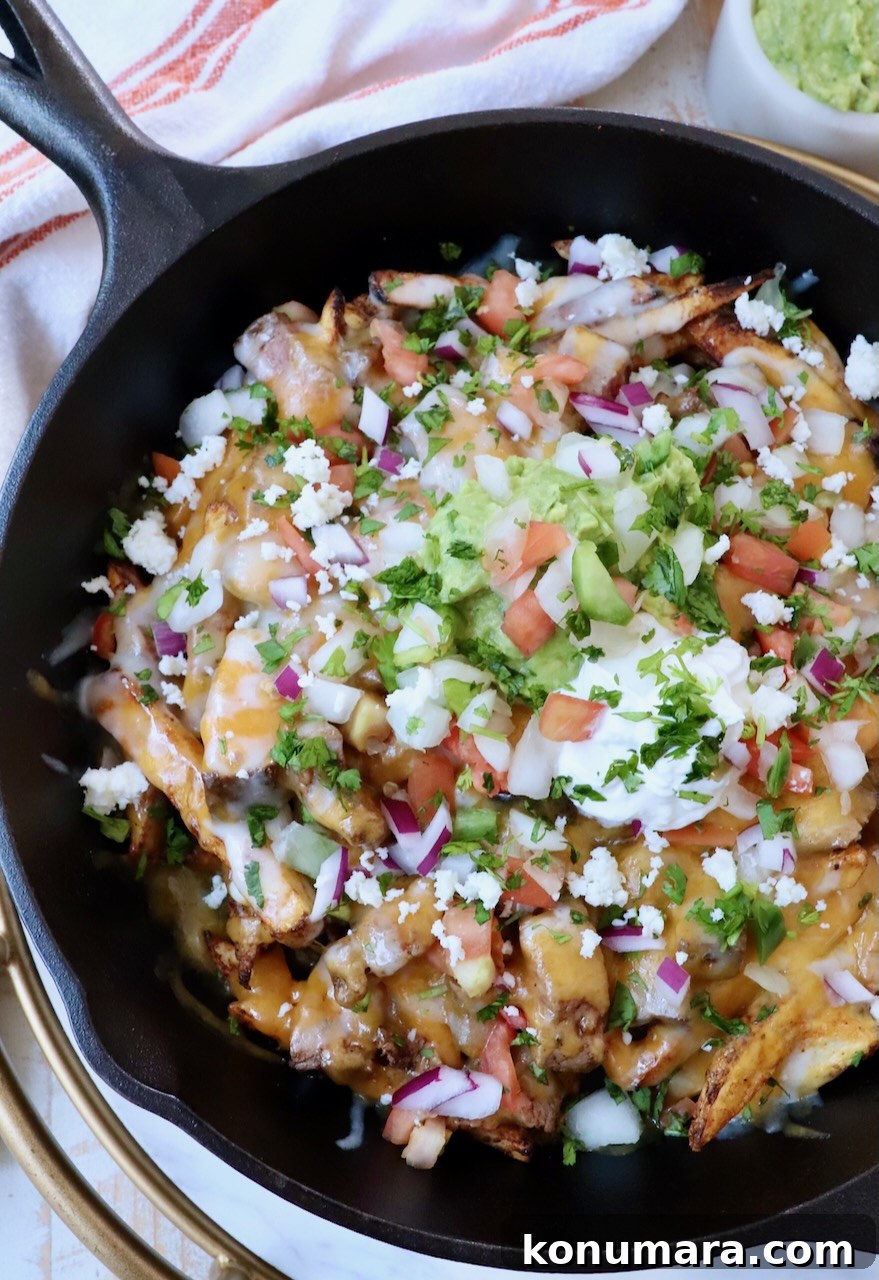 Carne Asada Fries Recipe: Crispy Fries with Grilled Steak 4 carne asada fries in cast iron skillet