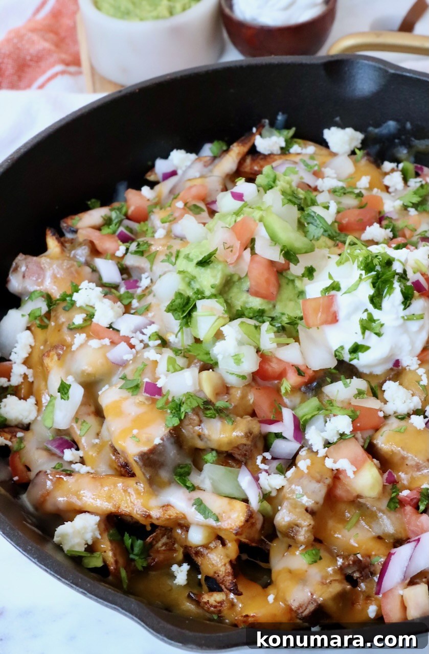 Carne Asada Fries Recipe: Crispy Fries with Grilled Steak 5 carne asada fries in cast iron skillet