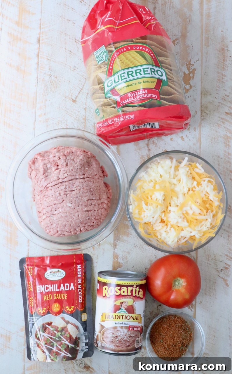 ingredients for Mexican pizza on white wood board