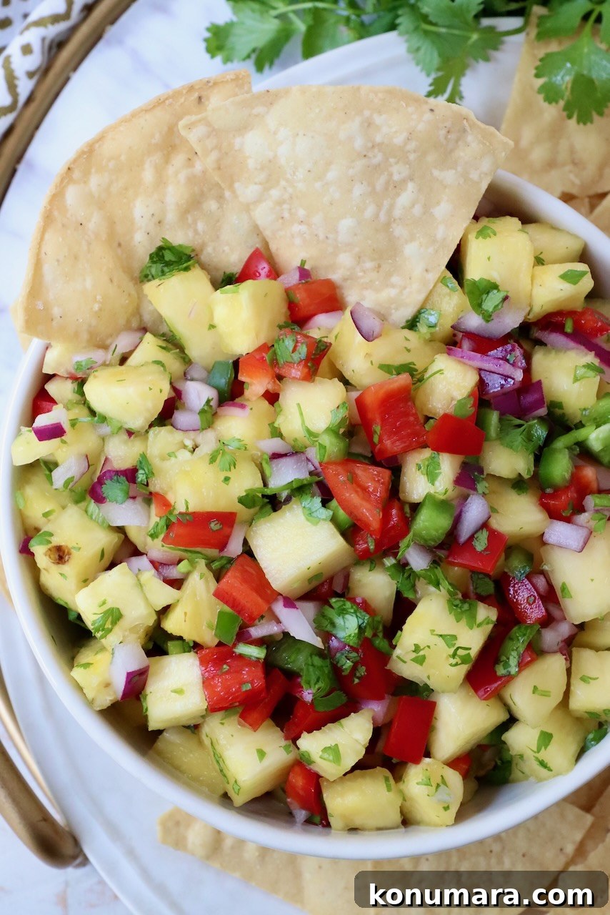 pineapple salsa in bowl with tortilla chips