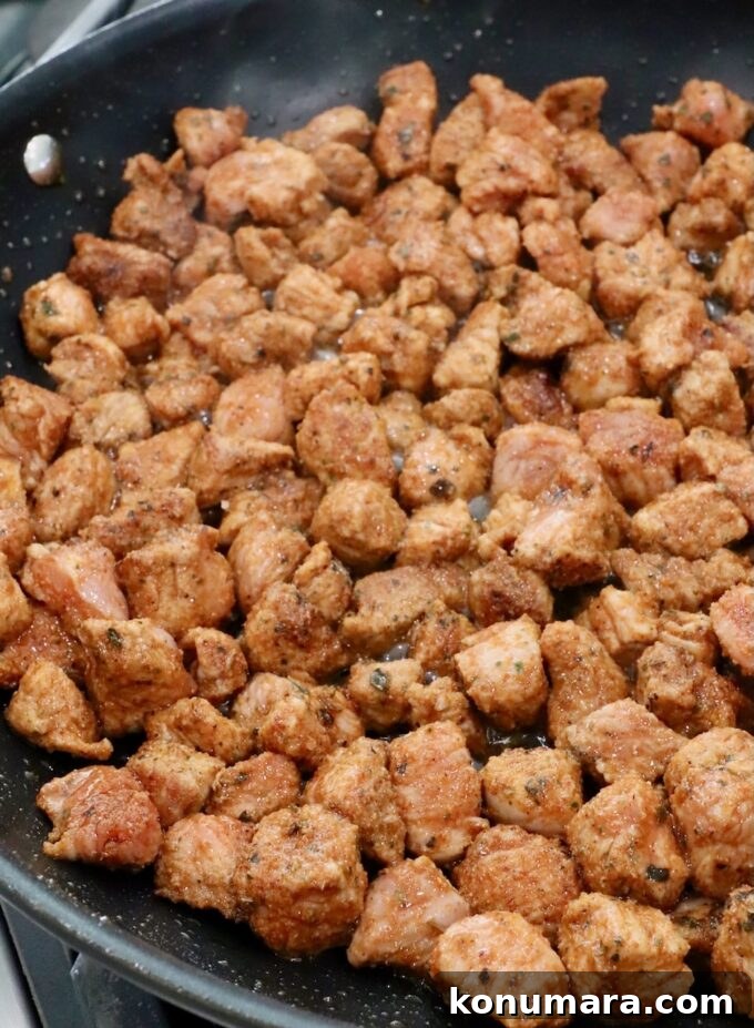 Homemade Carnitas Tacos Recipe with Salsa Verde 5 seasoned cooked diced pork in skillet