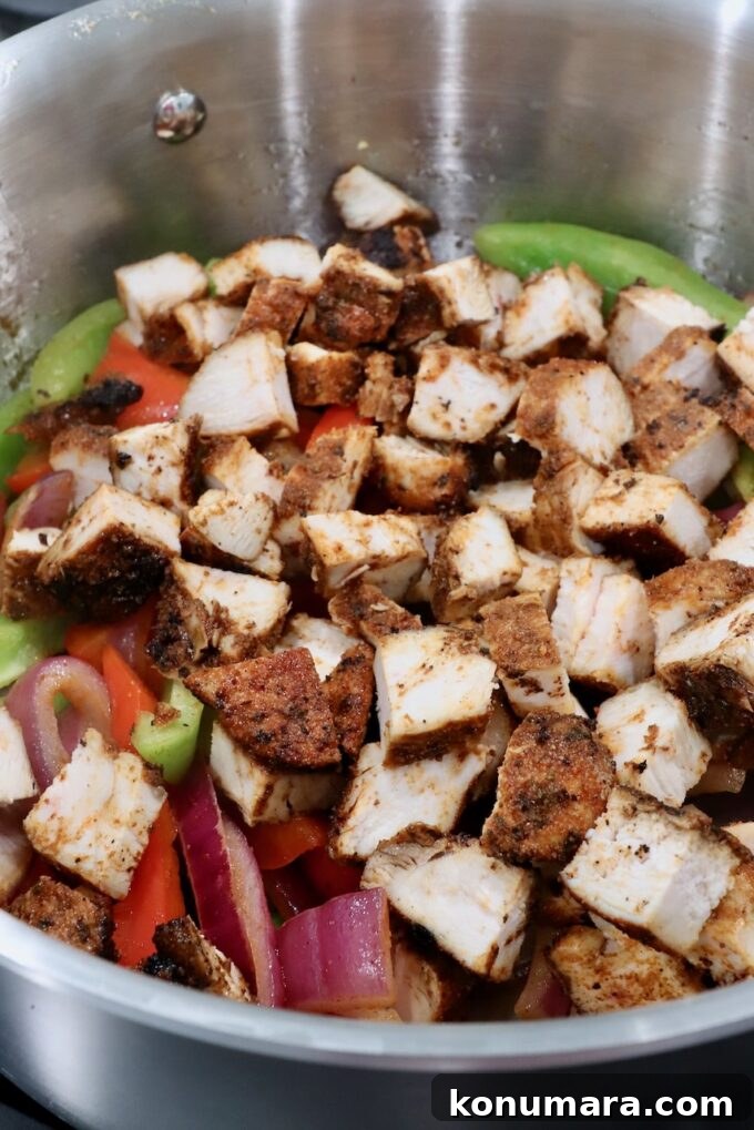 Crispy Chicken Quesadilla Recipe with Melty Cheese 6 diced grilled chicken with sliced onions and bell peppers in a pot