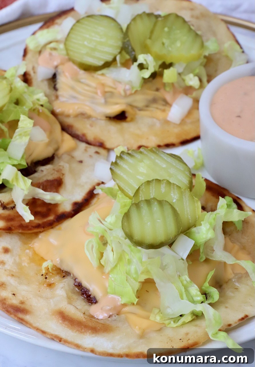 Smash Burger Taco Recipe: Crispy Smashed Patties 10 Smash burger tacos on a plate