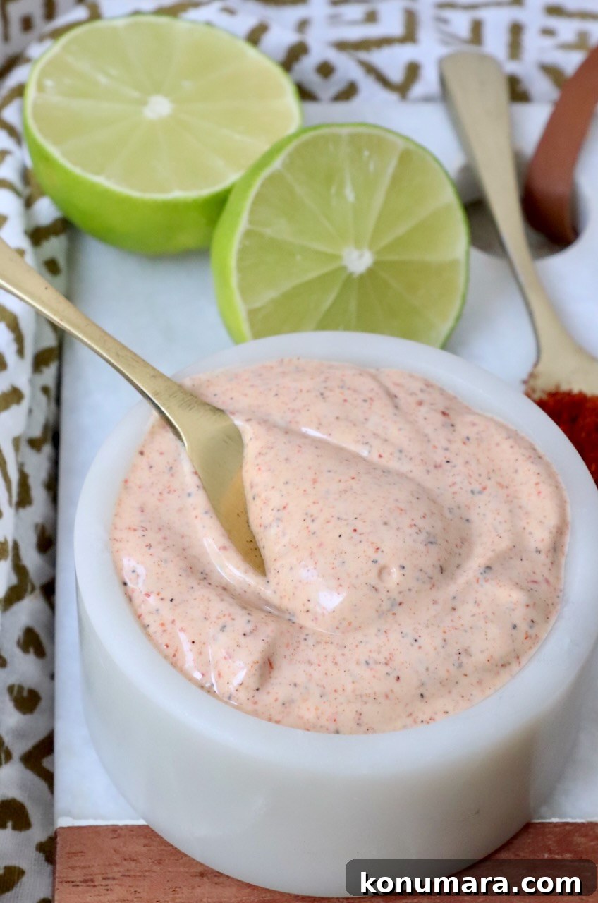 Chili Lime Dressing Recipe for Salads, Marinades and Tacos 2 chili lime dressing in bowl with small spoon