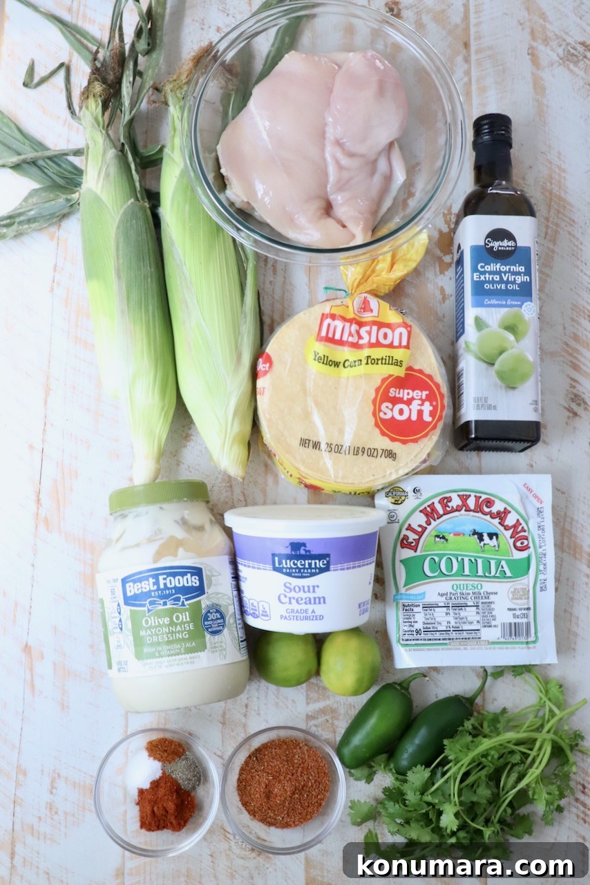 Elote Chicken Tacos with Mexican Street Corn 3 ingredients for chicken street corn tacos on white wood board