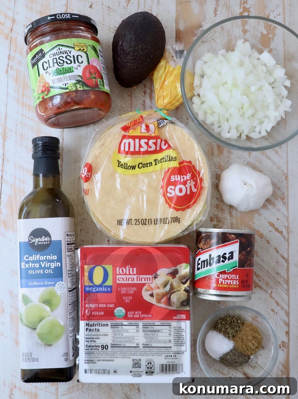 ingredients for tofu tacos on white wood board