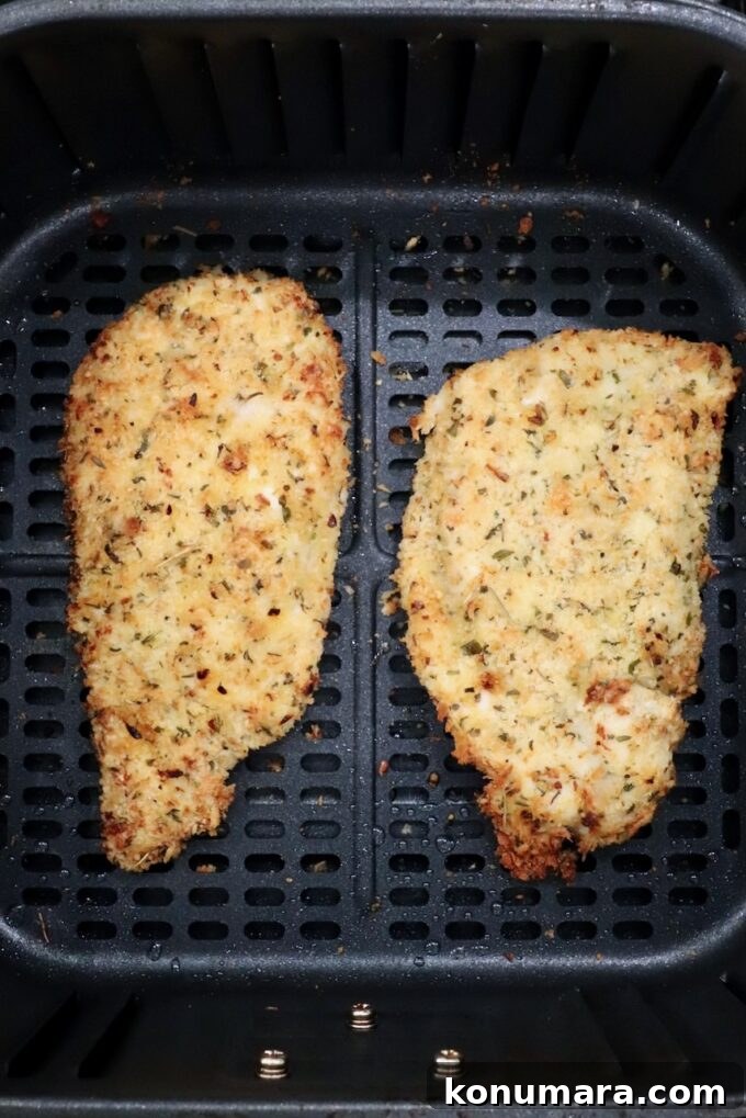 Crispy Parmesan-Crusted Chicken Recipe 14 cooked breaded chicken breasts in an air fryer